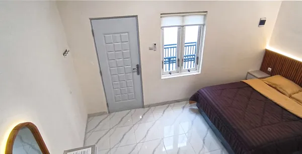 Dormitorio Executive en AVILITA House con cama queen size e iluminación ambiental suave